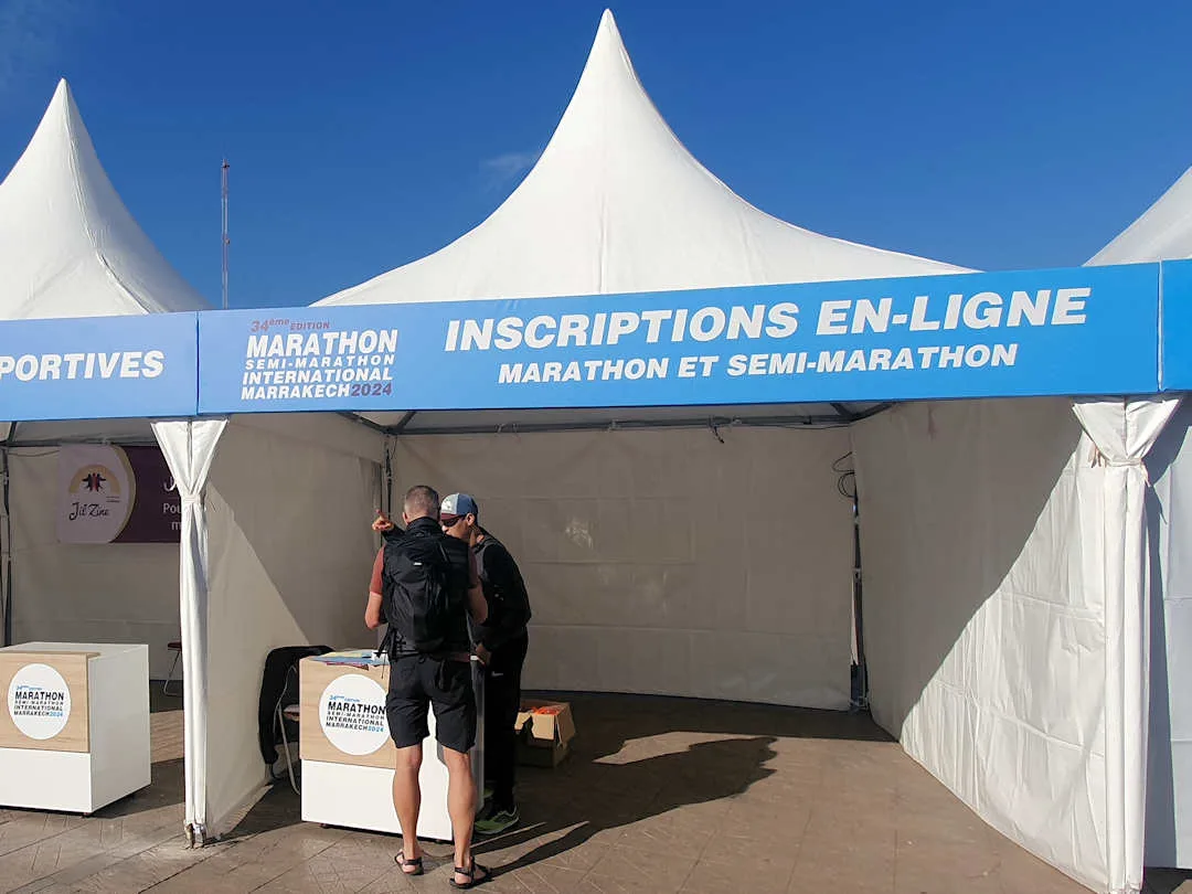 Registration tent for Marrakech Marathon event.